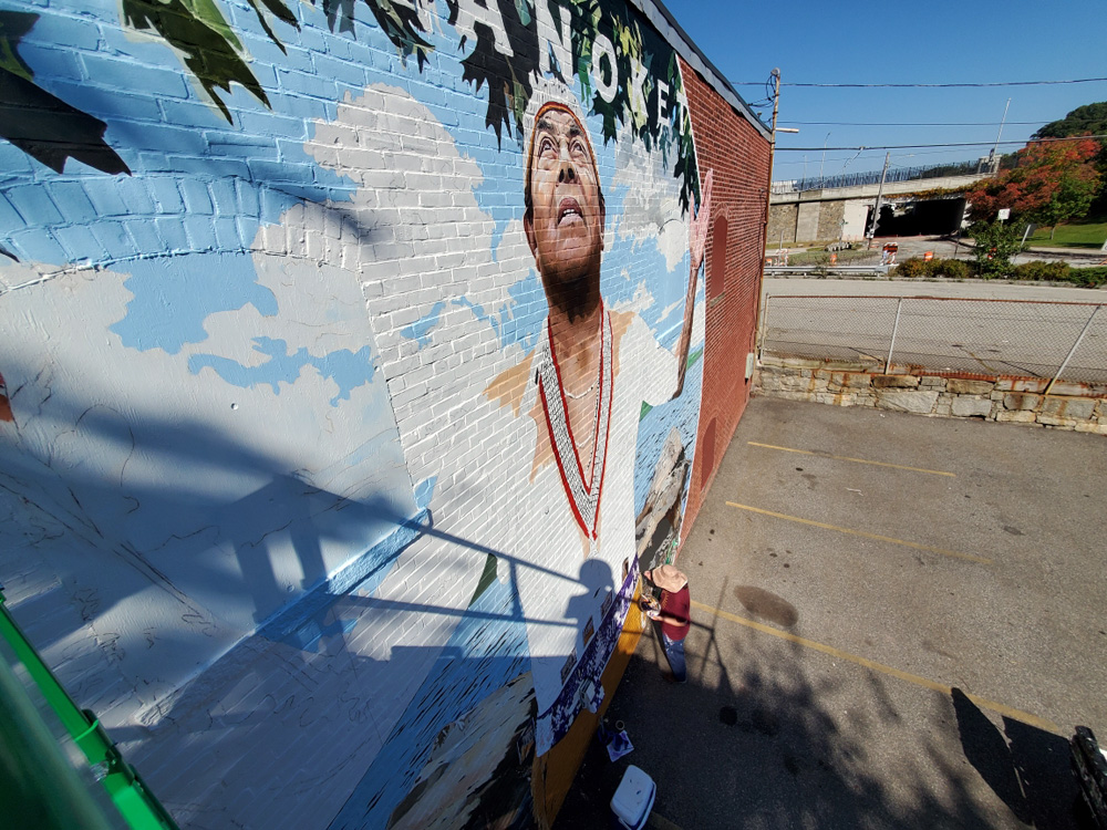 Artist Bonnie Lee Turner working on the Pokanoket Mural in East Providence, Rhode Island