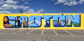 Postcard-style mural at the Groton Shoppers Mart celebrates the past and present of Groton, Connecticut